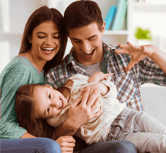 Young Family laughing & playing